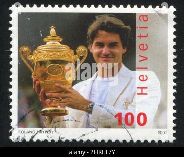 SCHWEIZ - UM 2007: Briefmarke gedruckt von der Schweiz, zeigt Roger Federer, um 2007 Stockfoto