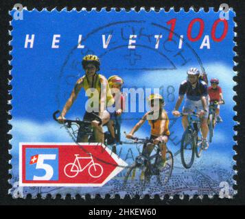 SCHWEIZ - UM 2004: Briefmarke gedruckt von der Schweiz, zeigt Radfahren, um 2004 Stockfoto