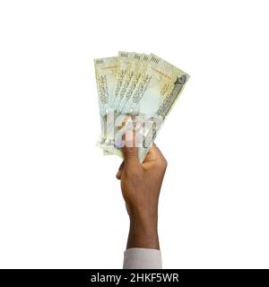 Schwarze Hand mit 3D gerenderten 20 Bahrain-Dinar-Noten isoliert auf weißem Hintergrund Stockfoto