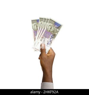 Schwarze Hand mit 3D gerenderten Croatia 1000 Kuna-Noten isoliert auf weißem Hintergrund Stockfoto