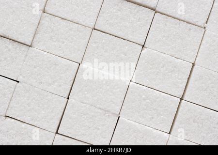 Oberflächenzucker raffiniert oder Laib-Zucker, Nahaufnahme. Hintergrund, Textur Stockfoto