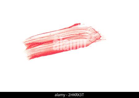 Strukturierter Lippenstift-Abstrich. Die rosa Farbe wird auf einem isolierten weißen Hintergrund hervorgehoben. Ein Element für kosmetisches Design. Hochwertige Fotos Stockfoto