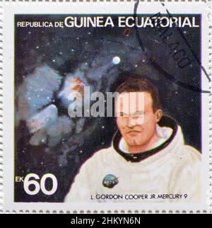 Abgesagte Briefmarke gedruckt von Äquatorialguinea, die L. Gordon Cooper Jr. zeigt - Mercury 9, um 1978. Stockfoto