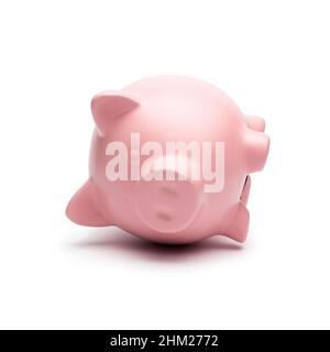 Sparschwein liegt auf der Seite Stockfoto