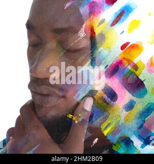 Paintographie. Ein Porträt eines Mannes kombiniert mit farbenfrohen Aquarellspritzern. Stockfoto