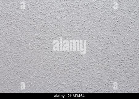 Hellgrau lackierte Zementwand-Textur für Tapete und Hintergrund. Abstrakter Hintergrund. Hintergrund mit Textur. Weiße Wand Stockfoto