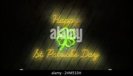 Bild der Worte Happy st patricks Day in neon flackernden gelben Buchstaben geschrieben Stockfoto