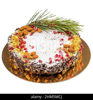 Traditionelle italienische Weihnachts-Panforte-Kuchen mit Früchten und Nüssen isoliert auf weißem Hintergrund Stockfoto