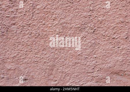 Beton mit rosa verputzten Wandmustern Hintergrund. Scharlachrote Wandstruktur grunge Hintergrund. Stockfoto