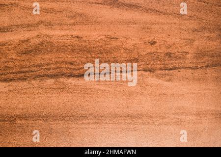 Dunkelbraun mit hellbraunem und schwarzen Nuancen gemusterter Struktur Hintergrund. Steinhintergrund Tapete Fliesen Stockfoto