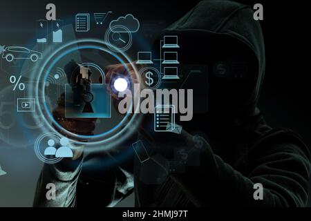 Studioporträt eines Mannes in einer Kapuze, ein Schatten versteckt sein Gesicht. Anonymität Schatten Wirtschaft und Flucht aus dem Gesetz Stockfoto