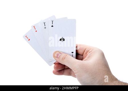 Vier Asse in der Hand eines Mannes auf einem weißen Stockfoto