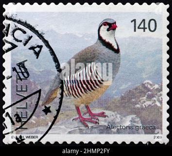 SCHWEIZ - UM 2009: Eine in der Schweiz gedruckte Marke zeigt Rock Partridge, Alectoris Graeca, ist ein GameBird aus der Familie der Pheasant, die im Süden geboren wurde Stockfoto