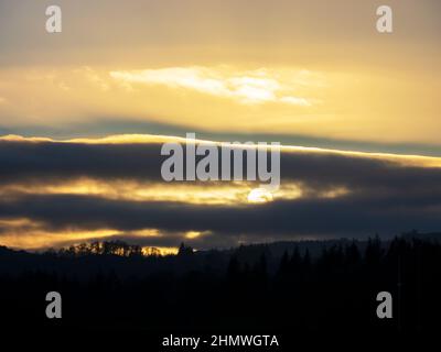 Wolken über Lake windermere bei Sonnenuntergang, Lake District, Großbritannien. Stockfoto