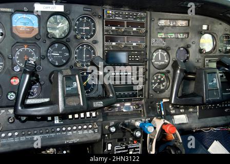 dashboard of an aircraft control panel showing all of the navigation gages, dials and other radio connectivity instruments Stockfoto