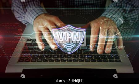 VPN Neon-Schild-Konzept, Virtual Private Network Symbol, Sicherheitsverbindung, Verschlüsselungstunnel Verbindungstechnologie. Kamera bewegt sich mit dem Mann, der auf tippt Stockfoto