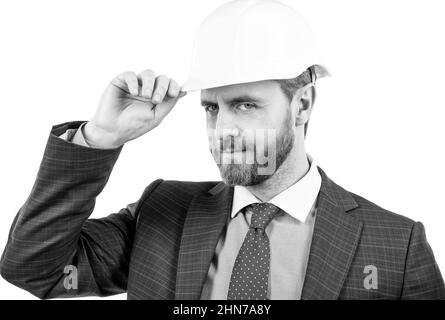 Sicherheitsgeschäft. Erfolgreicher Mann mit Grußgeste. Unternehmer in Schutzhelm. Stockfoto