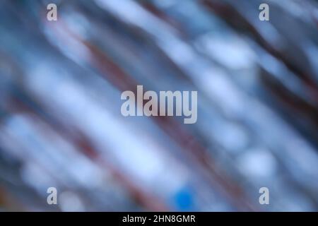 Verwischen Sie den abstrakten Hintergrund des gestreiften Plastikseils Stockfoto