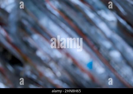 Verwischen Sie den abstrakten Hintergrund des gestreiften Plastikseils Stockfoto