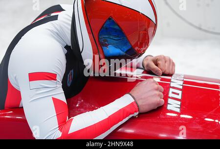 Peking, China. 15th. Februar 2022. Bob: Olympische Spiele, zwei-Mann-Bobbahn, Männer, 4th im Yanqing National Sliding Center läuft, reagiert Rudy Rinaldi aus Monaco nach seinem Lauf. Quelle: Michael Kappeler/dpa/Alamy Live News Stockfoto