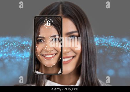 Asiatische Frau Gesichtserkennung und Erkennung durch Smart-Handy für die Entsperrung über den Technologie-Hintergrund, biometrische Verifikation, Computer Vision A Stockfoto