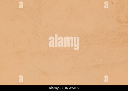 Alte ockerfarbene Wand gibt einen harmonischen Hintergrund Stockfoto