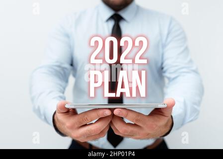 Schild mit dem Plan 2022, Wort für herausfordernde Ideen Ziele für das neue Jahr Motivation, neue technologische Ideen vorzustellen Stockfoto
