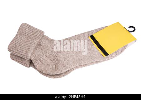 Beige warme Wintersocken elegant isoliert auf weißem Hintergrund Stockfoto