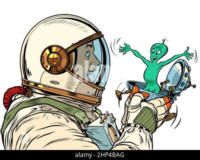 Ein überraschender männlicher Astronaut sieht einen Außerirdischen in einer festlichen UFO-fliegenden Untertasse-Box an. Pop Art Retro Vektor Illustration 50s 60s Vintage Kitsch Style Stockfoto