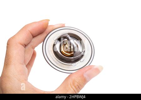 Thermostat für Auto in der Hand isoliert auf weißem HintergrundNahaufnahme Stockfoto