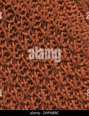 Stoff Kaffee farbige Textur für Hintergrund und Design. Braunfarbener abstrakt gewebter Strickmode im textilen Hintergrund. Stockfoto