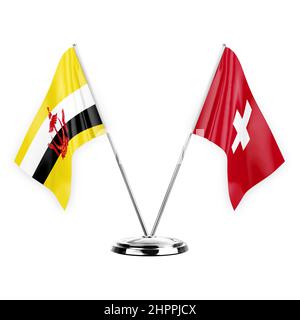 Zwei Tischfahnen isoliert auf weißem Hintergrund 3D Illustration, brunei und schweiz Stockfoto