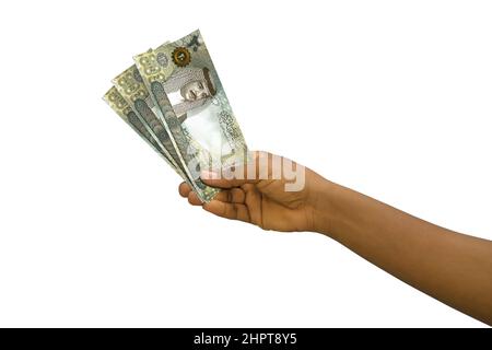 Fair Hand mit 3D gerenderten 20 Bahrain-Dinar-Noten isoliert auf weißem Hintergrund Stockfoto