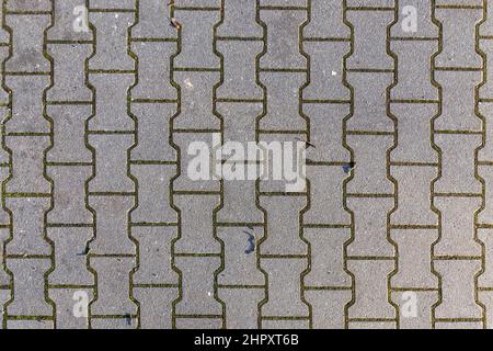 Hintergrund eines harmonischen Musters aus neuen Kopfsteinpflaster am Boden Stockfoto