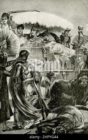 Die Bildunterschrift für dieses Bild von 1912 lautet: „Cleopatra in all ihrer Pracht - Kriegsgefangene, die vor Cleopatra gebracht werden, die auf ihrem Wagen sitzt.“ Kleopatra VII. (69-30 v. Chr.), die Tochter des Ptolemäus XI., von Ägypten. Sie heiratete ihren Bruder Ptolemäus XII und begann mit ihm Ägypten zu regieren, als sie 17 Jahre alt war. Später stellte sie sich mit Julius Caesar gegen ihren Bruder auf. Nach Caesars Tod schloss sie sich Mark Antony an. Nach Antonys Tod soll sie sich, wie die Legende sagt, durch den Biss einer Spange getötet haben. Stockfoto