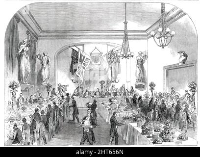 Großes Bankett an den Oberbürgermeister von London, in Hastings, [Sussex], 1850. „Das Bankett fand in einem eleganten Raum statt, der mit Statuen der Musen geschmückt war. Auf einem Tisch, in der Mitte des Raumes, stand... die große silberne Punschschale, die von den Baronen, die an der Krönung von König Georg II. Und Königin Caroline teilnahmen, präsentiert wurde...je mehr die Gäste sich einen Tisch besetzten...auf einem leicht erhöhten Podest. Hinter und über ihnen waren die Nationalfarben und das Unternehmenswappen. [Das Bankett] wurde von Herrn Carswell vom Swan Hotel, unterstützt von den Herren Ring und Brymer, durchgeführt.“ Der Mai Stockfoto