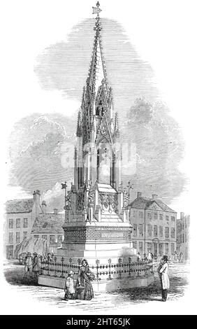 The Notts Testimonial to Lord George Bentinck, in the Market-Place, Mansfield, 1850. Monument entworfen von T. C. Hine: 'Eine reich verzierte gotische Struktur, etwa 50 Fuß; hoch, des Stils, der im vierzehnten Jahrhundert vorherrschte ... das ganze ist in drei Stufen unterteilt - die Basis oder Sockel; ein Giebeldach, gestützt auf Spitzpfeilern und geclusterte Säulen; Und eine erhabene Spitze, durchbohrt mit traceried und Giebellichtern, und beendet mit einem vergoldeten Flügel. Die untere Stufe besteht aus einer Treppe...mit Schilden der Wappenlager der Portland-Familie...den Giebeln des Canops Stockfoto