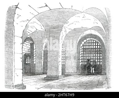 Corridor, Newgate Prison, [London], 1850. „Das Gefängnis von Newgate hat zweifelsfrei große Mängel im Vergleich zu moderneren Erektionen... Es ist sehr zu wünschen ... dass in Newgate keine Sätze (außer für sehr kurze Zeiträume) stattfinden sollen. Die fortwährende Aufregung, der ständig schwankende Charakter der Insassen, die Ansammlung von Verbrechern der flagrantesten Natur, die ständige Wiederholung der Sitzungen machen Newgate zu einem sehr unerwünschten Gefängnis für Zwecke der Verlängerung der Haft." Aus „Illustrated London News“, 1850. Stockfoto