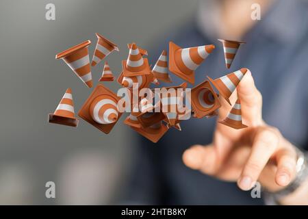 3D Darstellung von orangen Verkehrskegeln in der Luft, wobei ein Mann zwei Finger an ihnen hielt Stockfoto