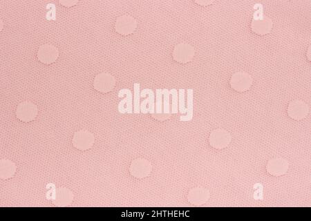Rosa dekoratives Gewebe aus Stoff mit Kreismustern als Hintergrund oder Textur. Probenmaterial. Stockfoto