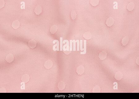 Rosa dekoratives Gewebe aus Stoff mit Kreismustern als Hintergrund oder Textur. Probenmaterial. Stockfoto