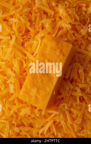 Geschreddert Sharp Cheddar Käse Hintergrund Stockfoto