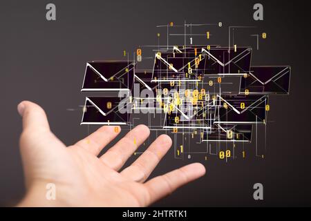 3D Rendern von E-Mail-Postfächern, die über einer Hand schweben, im grafischen Konzept der elektronischen Kommunikation Stockfoto