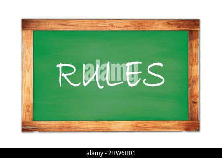 REGELN Text auf grünen Holzrahmen Schule Tafel geschrieben. Stockfoto