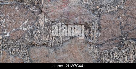 Textur einer Steinmauer. Alte Burg Stein Wand Textur Hintergrund. Stein Wand als Hintergrund oder Textur. Teil einer Mauer aus Stein, für den Hintergrund oder Text Stockfoto