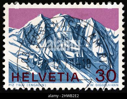 SCHWEIZ - UM 1970: Eine in der Schweiz gedruckte Briefmarke zeigt den Piz Palu Berg, um 1970. Stockfoto