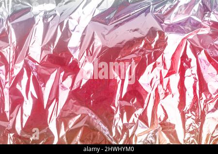 Farbenfroher Folienhintergrund mit glänzend zerknittert Oberfläche für Textur-Hintergrund. Stockfoto