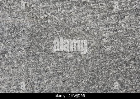 Hintergrund mit grauer und weißer Natursteinstruktur. Stockfoto