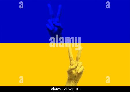 Ukraine Hände auf ukrainische Flagge ok Zeichen Sieg Stockfoto