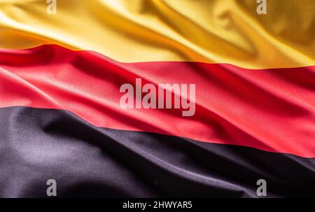 Winkende Flagge Deutschlands. Nationales Symbol für Land und Staat. Stockfoto